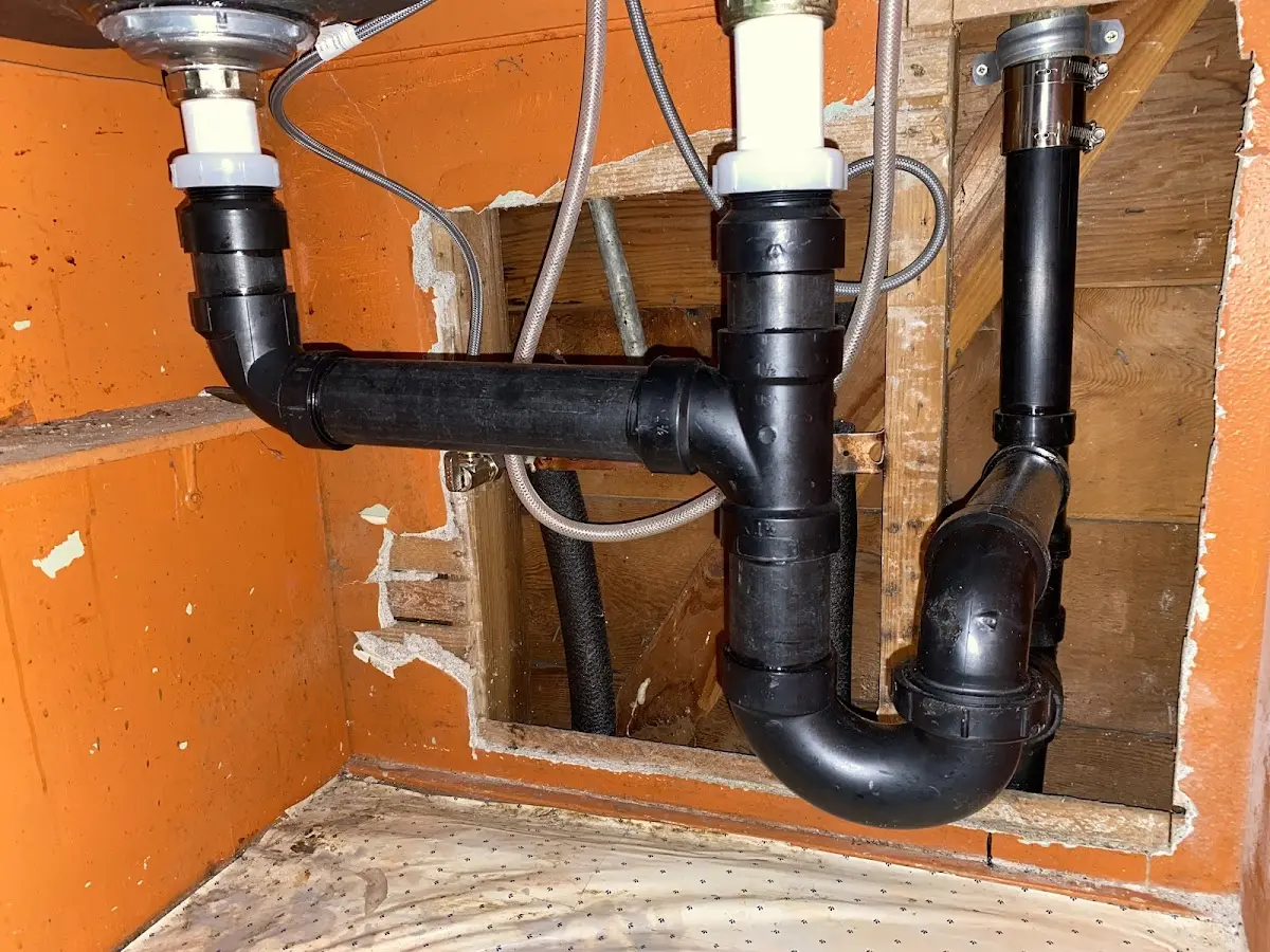 Professional Garbage Disposal Repair equipment and tools on the job in Superior